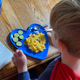 My son enjoying his IsiBisi gluten-free elbow pasta with Violife’s “Just Like Cheddar Shreds” for his homemade mac-and-cheese.